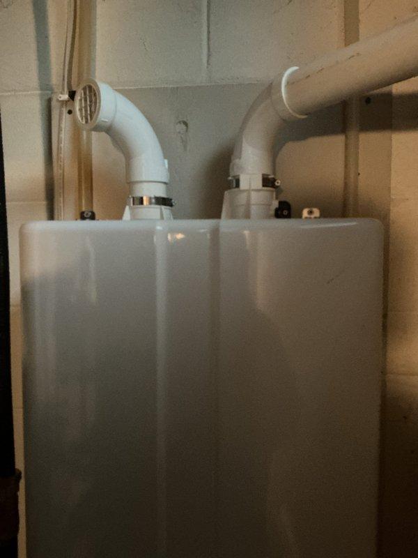Performed descaling maintenance service on Navien tankless water heater unit. Flushed system with descaling solution to remove mineral buildup and restore optimal heating efficiency. Verified proper operation of unit and all connections upon completion.