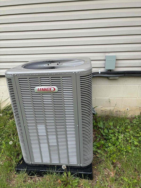Performed routine air conditioning maintenance on residential Lennox condensing unit. Conducted comprehensive system inspection including examination of outdoor unit cabinet, fan grille, and electrical components. Inspected control board circuitry, sensors, and output disconnect terminals to ensure proper operation and verify all electronic components were functioning within normal parameters.