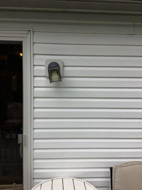 Responded to service call for multiple lighting issues in 25-year-old residential property. Troubleshot and restored power to three first-floor rooms that had lost lighting functionality, identifying and resolving circuit issues at the electrical panel. Replaced existing outdoor carriage light fixtures with new customer-provided units, ensuring proper mounting, wiring connections, and weatherproof installation on exterior siding. All lighting circuits tested and verified operational upon completion.
