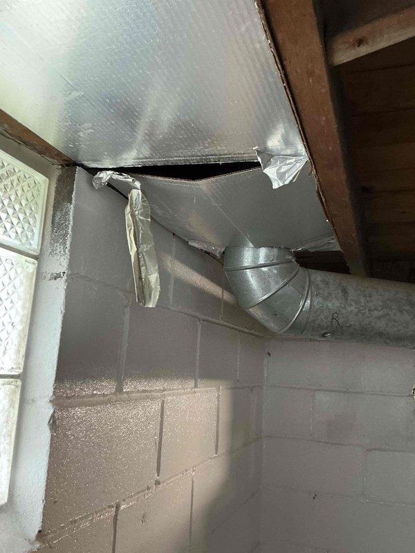 Completed HVAC estimate for heat pump and propane furnace replacement in new rehabilitation property. Assessed existing basement mechanical space with concrete block walls, exposed ceiling joists, and current ductwork configuration including galvanized metal supply ducts and air handler unit. Documented installation area conditions, support structures, and spatial requirements for proposed equipment replacement system.