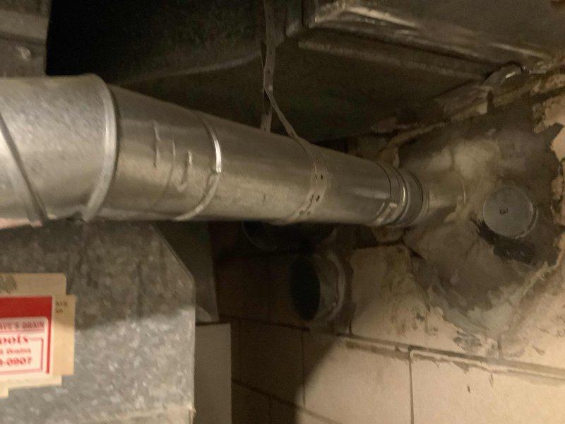 Provided estimate for replacement of water heater over 10 years old. Inspected existing installation including water supply lines with blue-handled ball valves, PVC piping configuration, and flexible stainless steel connectors in utility area. Documented current equipment condition and mechanical room layout for water heater replacement quote.