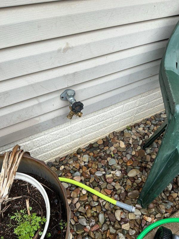 Responded to service call for leaking frost-free spigot that failed to shut off water flow completely. Inspected exterior hose bib mounted on vinyl siding and traced supply line to shutoff valve in attic crawl space. Replaced faulty frost-free sillcock assembly and verified proper operation of shutoff mechanism. Tested unit for complete water shutoff and confirmed no leakage at exterior spout or interior connection points.