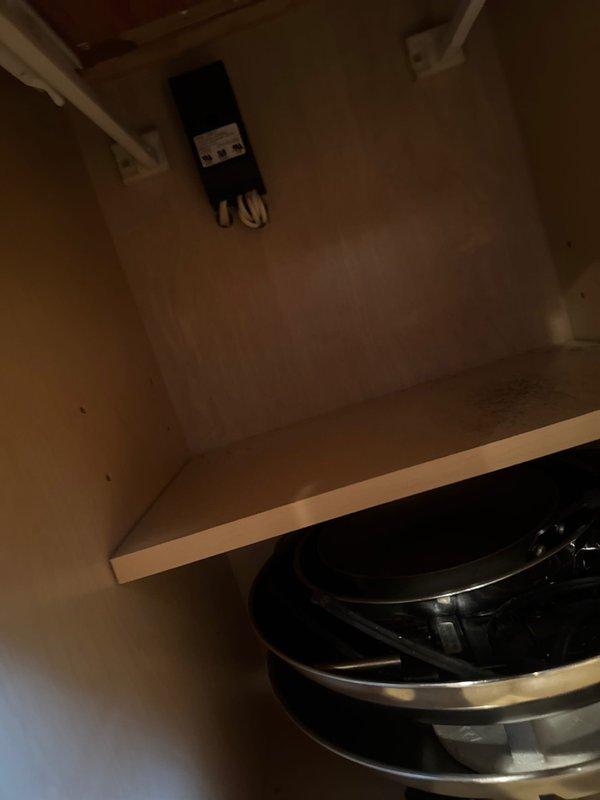 Responded to service call for under-cabinet lighting experiencing electrical short in older residential property. Upon inspection, identified faulty wiring connections in cabinet lighting circuit causing intermittent power failure and potential safety hazard. Traced circuit from main panel through conduit system, located deteriorated wire connections within cabinet fixture assembly. Removed defective under-cabinet light fixture, replaced damaged wiring and connections, and reinstalled properly grounded lighting system. Verified all electrical connections were secure, tested circuit for proper voltage and continuity, and confirmed lighting operates safely without shorts or electrical faults.