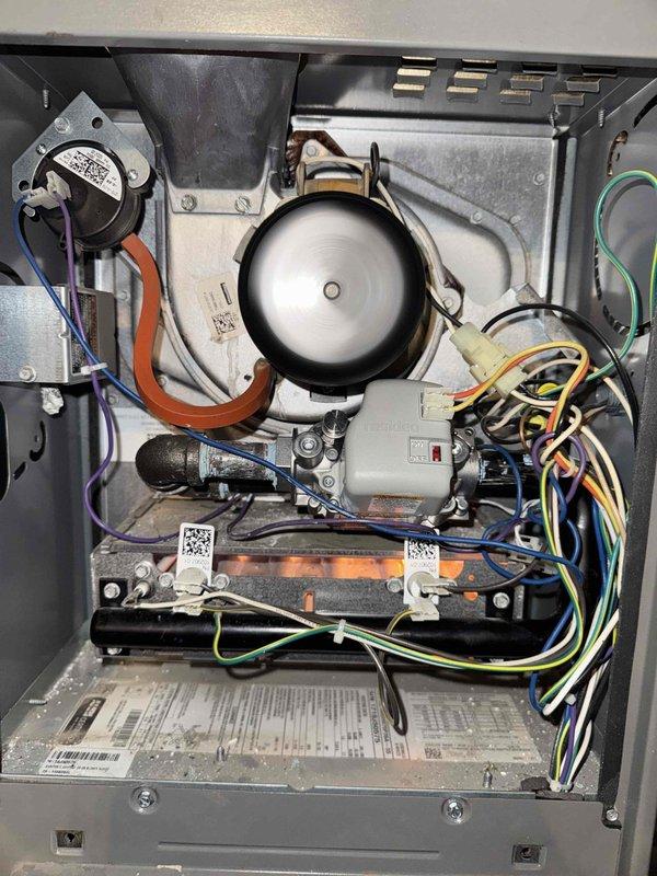 Responded to no-heat call on 7.5-year-old gas furnace for free second opinion diagnostic. Upon arrival, removed access panel and performed comprehensive visual inspection of all internal components including blower assembly, inducer motor, ignition system, and control board. Examined FASCO inducer motor assembly with connected pressure switch tubing, verified all wire connections to Honeywell control module, and inspected hot surface igniter assembly for cracks or damage. Documented internal condition of furnace with detailed photographs showing all major components, wiring harnesses, and mounting hardware. Unit showed normal dust accumulation consistent with age and operation. Performed thorough diagnostic evaluation to identify root cause of heating failure and provided customer with professional assessment and repair recommendations.