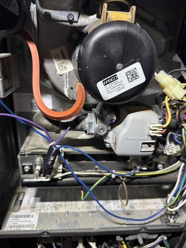 Responded to no-heat call on 7.5-year-old gas furnace for free second opinion diagnostic. Upon arrival, removed access panel and performed comprehensive visual inspection of all internal components including blower assembly, inducer motor, ignition system, and control board. Examined FASCO inducer motor assembly with connected pressure switch tubing, verified all wire connections to Honeywell control module, and inspected hot surface igniter assembly for cracks or damage. Documented internal condition of furnace with detailed photographs showing all major components, wiring harnesses, and mounting hardware. Unit showed normal dust accumulation consistent with age and operation. Performed thorough diagnostic evaluation to identify root cause of heating failure and provided customer with professional assessment and repair recommendations.