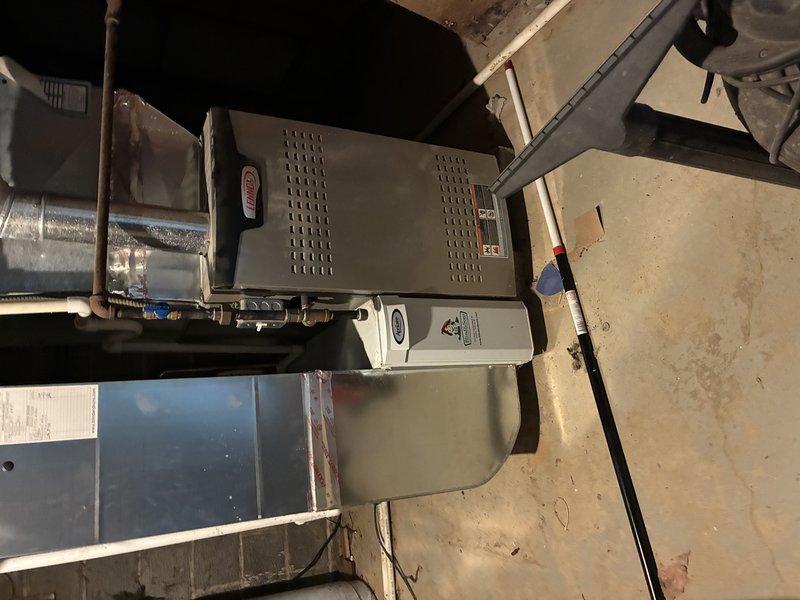 Responded to service call for loud squealing noise from furnace. Upon inspection, diagnosed worn blower motor bearings as the source of the noise complaint. Lubricated blower motor bearings and verified proper operation of the heating system, confirming noise was eliminated and unit returned to normal, quiet operation.