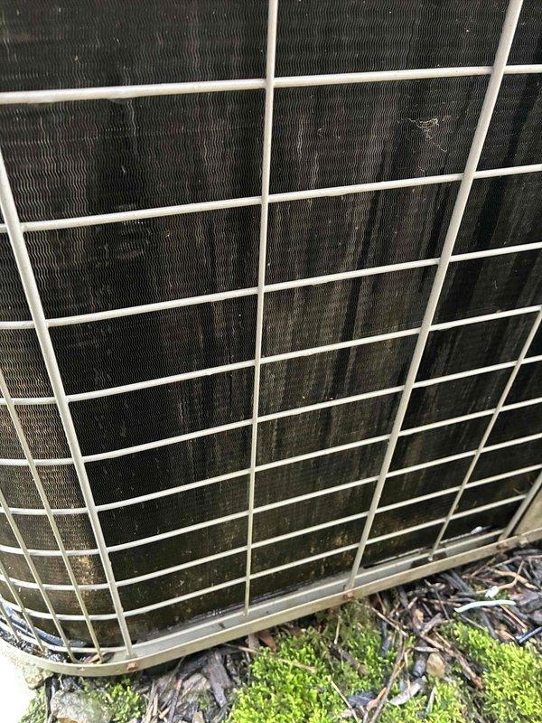 Completed routine air conditioning maintenance on 17-year-old residential cooling system. Performed inspection of outdoor condenser unit, which showed significant dirt and debris accumulation on coil surfaces requiring attention. Inspected indoor Bryant furnace and associated ductwork in basement mechanical room, verified system operation, and confirmed proper airflow through the HVAC system.