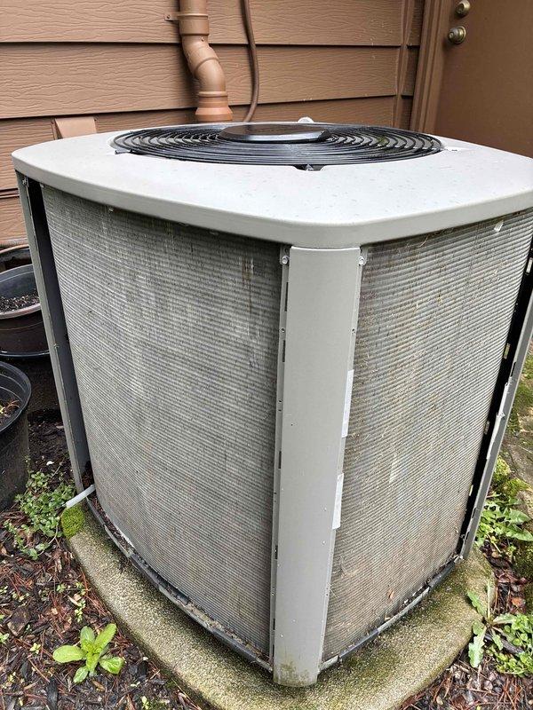 # HVAC Maintenance - Cooling

Performed comprehensive preventive maintenance on a 9-year-old residential air conditioning system under the maintenance value plan. Upon arrival, conducted visual inspection of the outdoor condenser unit, which revealed moderate accumulation of debris and dust particles on the condenser coil fins. The unit was operating but showed signs of reduced airflow efficiency due to the buildup on the coil surfaces.

Completed standard maintenance procedures including cleaning of the condenser coils to remove accumulated dirt, dust, and organic debris from the fin surfaces. Inspected the condenser fan motor and verified proper operation. Checked electrical connections and confirmed secure mounting on the concrete pad. Evaluated the overall condition of the unit's exterior housing and protective mesh panels, noting typical weathering consistent with outdoor exposure.

Verified refrigerant levels and system pressures within manufacturer specifications. Tested system 