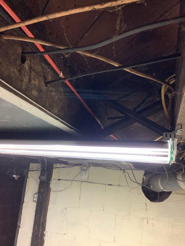 Completed AC circuit installation for permanent wiring infrastructure in basement crawl space area. Installed new electrical conduit routing along exposed joists, integrated junction boxes and support brackets to existing structural framework, and verified proper circuit protection and code compliance. All wiring secured to wooden beams with appropriate standoffs to maintain clearance from plumbing lines, HVAC ductwork, and insulation materials.