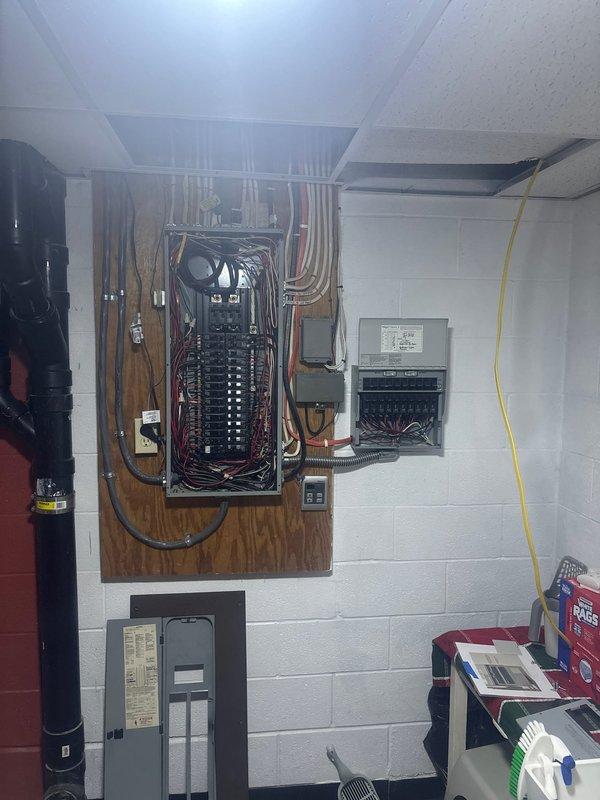 Completed installation of 26kW standby generator with cold weather kit on new concrete pad. Installed 150-amp automatic transfer switch in interior utility room with proper electrical panel integration, ran 90 feet of electrical service line from generator to transfer switch, and connected 30 feet of gas supply line to fuel source. Mounted exterior electrical disconnect box on building exterior wall with appropriate conduit routing and weatherproof enclosure, verified all electrical connections at transfer switch and circuit breaker panel, and confirmed proper operation of automatic transfer system.