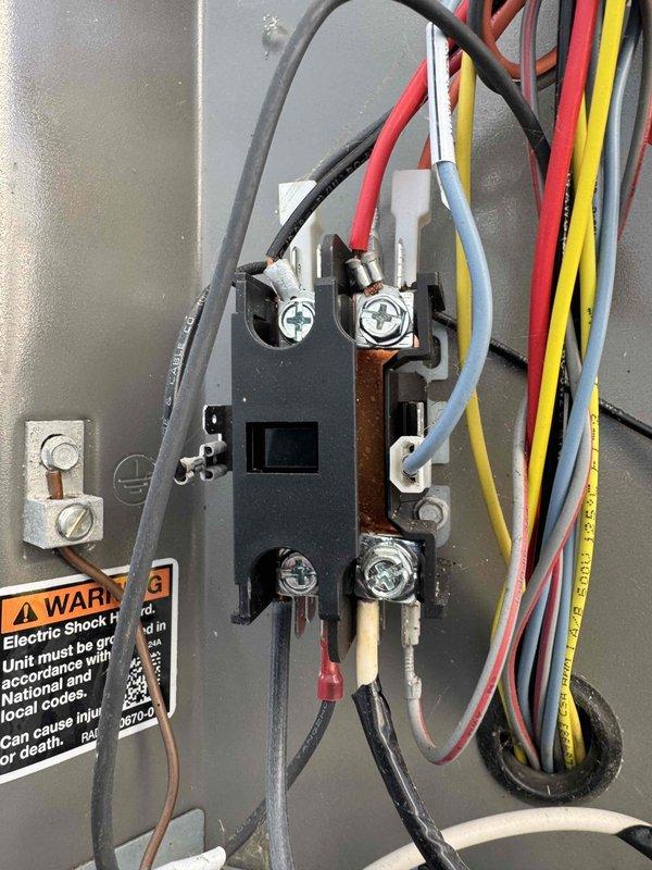 Completed annual preventative maintenance on a one-year-old air conditioning system under manufacturer's warranty plan. Performed comprehensive inspection of outdoor condensing unit, including examination of electrical connections at the contactor and assessment of condenser coil condition. Noted moderate accumulation of dirt and debris on exterior coil fins, which was documented with photographs. All electrical terminations at the contactor were verified to be secure with proper wire connections intact. System operational check confirmed unit is functioning within normal parameters.