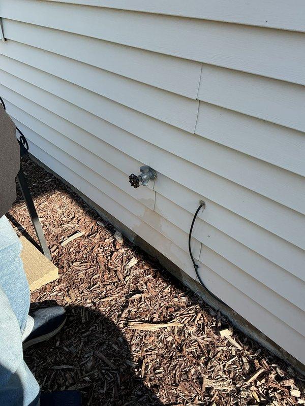 Conducted on-site evaluation for exterior hose bib replacement on residential property. Inspected existing outdoor spigot mounted on vinyl siding, noting current fixture condition and connection points. Assessed interior plumbing infrastructure including water supply lines, shut-off valves, and water meter assembly to determine optimal replacement approach and verify compatibility with existing copper piping system. Performed complimentary water quality testing as requested to evaluate overall system performance and identify any potential concerns with water supply.