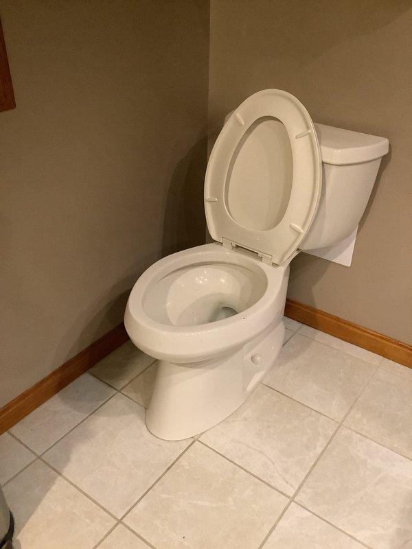 Responded to a service call for a malfunctioning toilet with dual issues: a clog causing drainage problems and a continuously running fill valve creating potential overflow concerns. Upon inspection, cleared the obstruction from the toilet trap and verified proper drainage function. Diagnosed and repaired the faulty flapper valve assembly in the tank, which was preventing the fill valve from shutting off properly. Tested the flush mechanism multiple times to ensure complete water shutoff and proper bowl refill levels. Confirmed all components functioning correctly with no leaks or continuous water flow, eliminating the flooding risk.