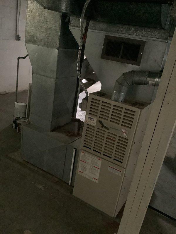 Conducted on-site evaluation for central air conditioning system installation in residential single family home undergoing remodeling. Assessed existing ductwork infrastructure, furnace equipment, and electrical panel capacity to determine compatibility with new AC system. Documented existing HVAC configuration including furnace unit, metal ductwork, air handler, and electrical service panel with available breaker capacity for future outdoor condensing unit connection.