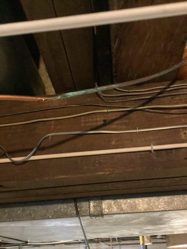 Responded to emergency water leak from hot water tank. Upon inspection, confirmed active leak at base of unit requiring immediate attention. Documented existing water heater condition and surrounding plumbing connections for service records.