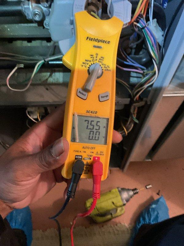 Responded to no-heat call on 13-year-old furnace that would not stay running and was blowing cold air when operational. Performed diagnostic testing using multimeter to check electrical components and control board functionality. Upon inspection, identified issues with the furnace's heating cycle and electrical system. Tested voltage readings at the control board, which displayed 255V on the diagnostic meter. Removed access panel to access internal components, examined control board, transformer, wiring connections, and safety circuits. All findings documented with photos for service records.