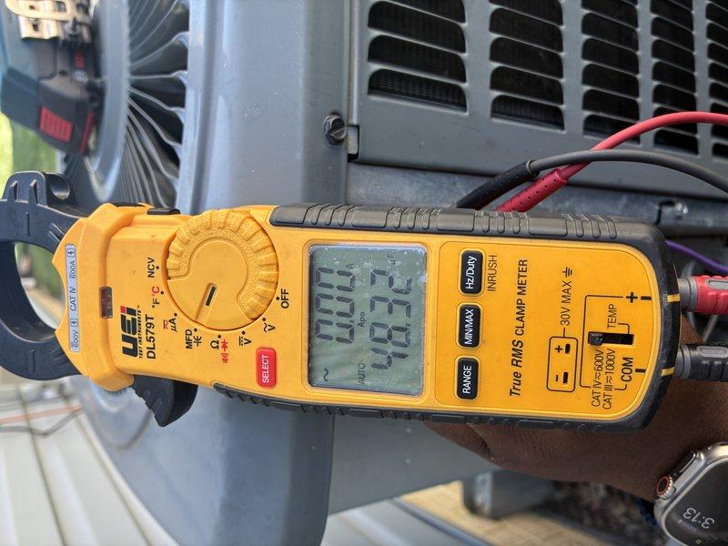 Completed scheduled cooling maintenance on 7-year-old air conditioning system. Upon inspection, discovered extensive frost and ice buildup on evaporator coil assembly, indicating restricted airflow or potential refrigerant issue. Performed diagnostic testing with multimeter at outdoor condenser unit to assess electrical values and system performance. Documented frozen coil condition and system readings for further evaluation and necessary repairs.