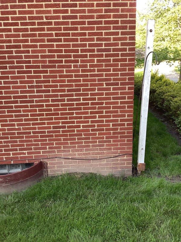 Completed installation of a 1-to-1 mini split system for a residential property. Mounted the indoor air handler unit in an upper-level room with sloped ceiling and installed the outdoor condensing unit on the exterior brick wall. Ran refrigerant lines and electrical connections between the indoor and outdoor components, ensuring proper system operation and testing upon completion.