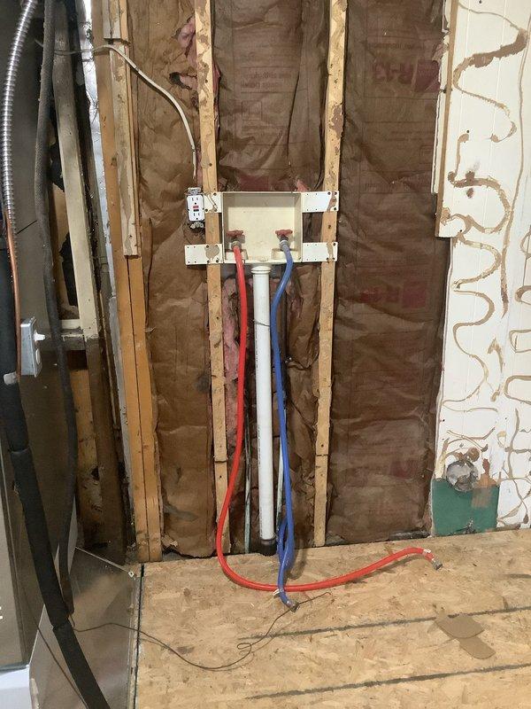 Completed comprehensive plumbing estimate for main sewer line and drain pipe replacement. Assessment revealed exposed plumbing infrastructure with PEX supply lines (hot and cold water) and existing drain systems requiring replacement due to deterioration and moisture damage. Documentation included interior wall cavity conditions showing compromised drywall with water staining, exposed framing, and accessible pipe routing. Crawlspace inspection identified copper piping systems with visible oxidation and significant moisture intrusion patterns on subfloor materials, indicating potential drainage issues contributing to the need for sewer line replacement. Provided detailed photographic documentation of existing conditions for estimate preparation, including supply line configurations, structural access points, and extent of water damage to surrounding building materials.