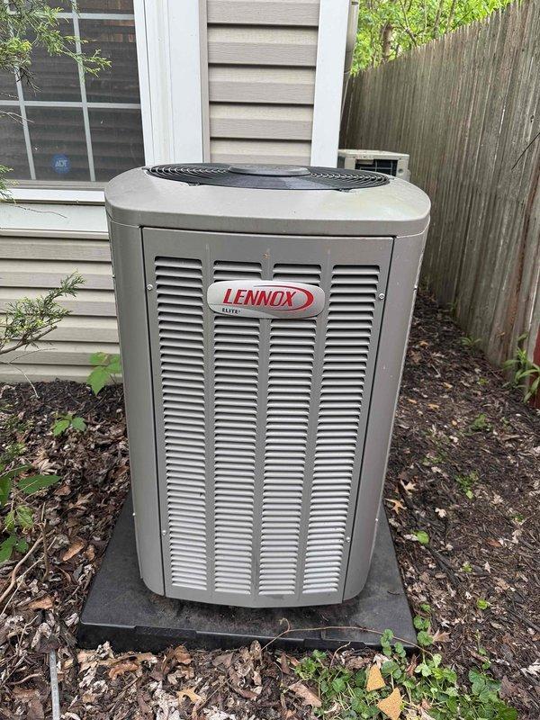 Responded to service call for excessive noise from outdoor Lennox air conditioning condenser unit. Upon inspection, confirmed unit was improperly installed on unlevel concrete pad, causing increasing vibration and noise when fan motor operates. Verified unit is out of level using torpedo level on top grille assembly. Improper ground preparation beneath pad is causing instability and operational issues requiring correction.