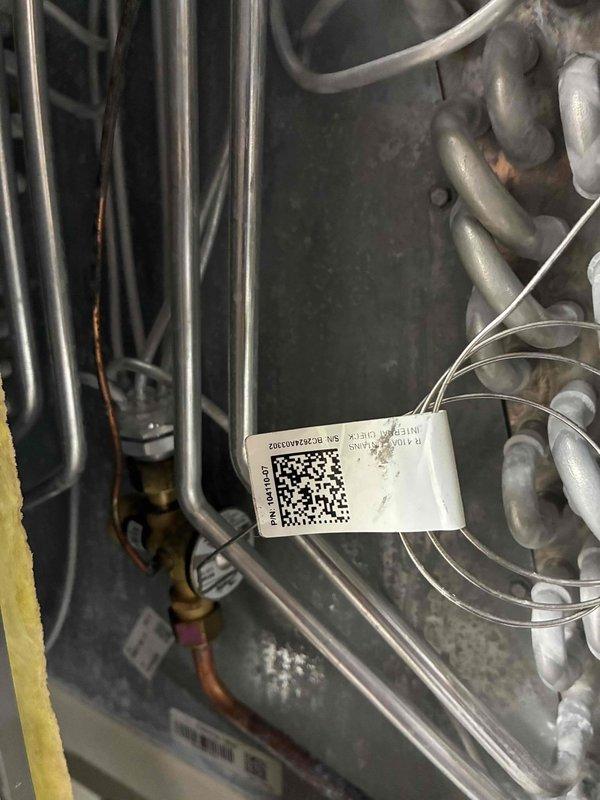 Completed comprehensive MVP tune-up service on cooling system, including full inspection of HVAC unit interior components, refrigerant lines, and electrical control systems. Verified proper operation of control board connections, inspected all wire harnesses and electrical components within the enclosure, and documented equipment condition with detailed photography including QR-tagged identification labels for service tracking purposes.