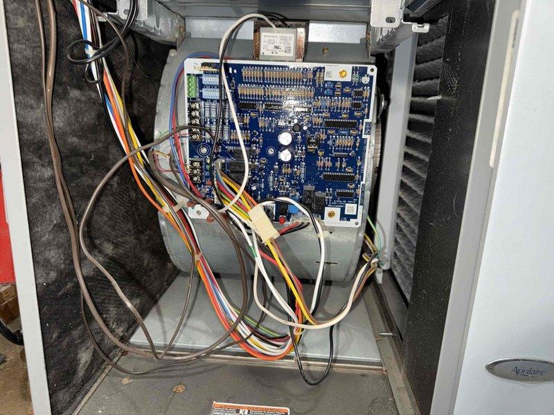 Completed scheduled preventive maintenance cooling visit on 5-year-old HVAC system. Performed comprehensive inspection of control board assembly, verified all electrical connections and wiring integrity across multiple circuits including power and control wiring. Inspected Aprilaire humidification component, examined heat exchanger coil assembly and fins for proper condition, and checked ventilation grille and mounting hardware for secure installation and proper airflow direction.