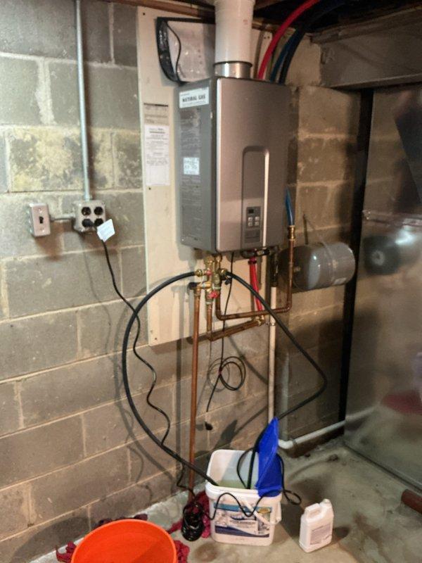 Performed annual maintenance flush on tankless water heater unit. Isolated unit using shut-off valves, connected flushing equipment via service ports, and circulated descaling solution through heat exchanger to remove mineral buildup. Inspected all plumbing connections, electrical components, and control panel operation. Unit tested successfully with no issues found; system restored to normal operation with optimal performance confirmed.