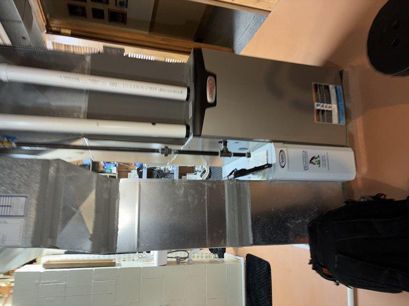 Completed annual cooling system maintenance on a 5-year-old air conditioning unit. Inspected system components in the utility room, replaced heavily soiled air filter with visible dust accumulation, and verified proper operation of all mechanical equipment to ensure optimal system performance for the cooling season.