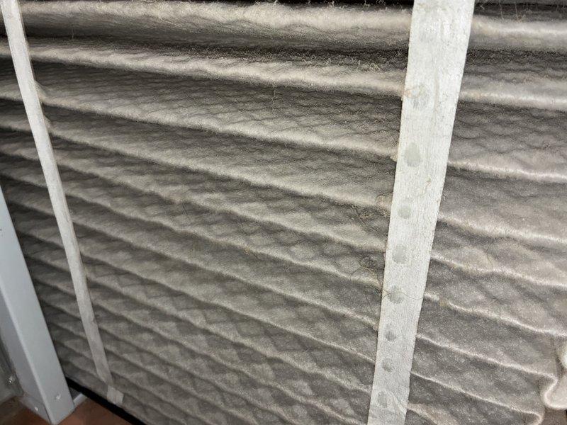 Completed annual cooling system maintenance on a 5-year-old air conditioning unit. Inspected system components in the utility room, replaced heavily soiled air filter with visible dust accumulation, and verified proper operation of all mechanical equipment to ensure optimal system performance for the cooling season.
