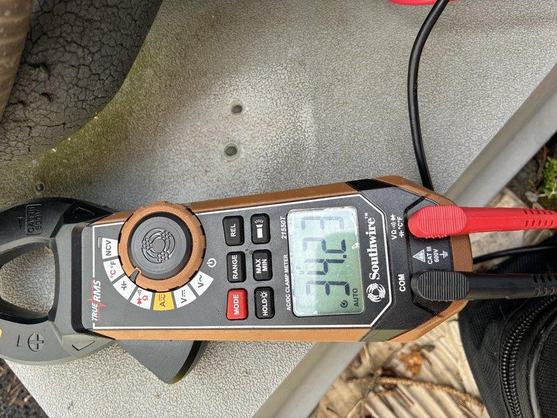 Completed preventive maintenance inspection on 9-year-old Lennox air conditioning system. Performed electrical diagnostics using clamp meter to verify proper amperage draw and system operation. Inspected outdoor condenser unit, confirmed adequate airflow through coil fins, and verified unit is operating within manufacturer specifications.