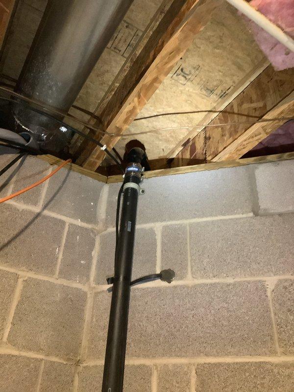 Replaced faulty sump pump check valve and rebuilt the discharge line section exiting the residence. Secured piping to wall with appropriate strapping to ensure proper drainage flow and prevent future movement. Work completed over two hours following parts delivery to shop.