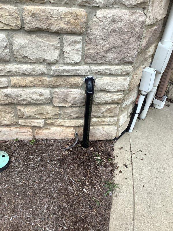 Replaced faulty sump pump check valve and rebuilt the discharge line section exiting the residence. Secured piping to wall with appropriate strapping to ensure proper drainage flow and prevent future movement. Work completed over two hours following parts delivery to shop.