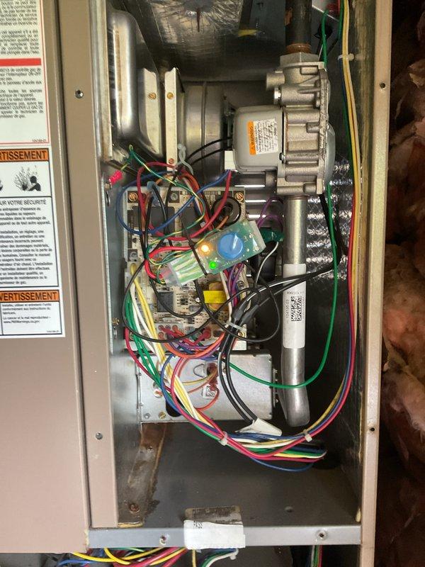 Completed BS-MVP cooling maintenance visit on 5-year-old air conditioning system. Performed standard preventive maintenance inspection of Macrojet HVAC unit including examination of blower assembly, electrical connections, capacitor, and control board components. Customer inquired about sourcing replacement for washable/reusable air filter, reporting difficulty locating correct size through standard retail channels. Documented system condition with photos of interior control panel showing wiring, motor assembly, and electrical components, as well as exterior unit installation in mechanical room. Advised customer that specialty filter can be ordered through supplier to match existing specifications.