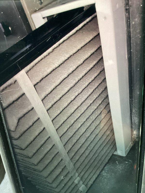 Completed comprehensive preventive maintenance on 11-year-old air conditioning system. Inspected evaporator coil and found moderate dust accumulation and discoloration on fin surfaces, with visible contamination affecting heat transfer efficiency. Evaluated air filtration system and noted pleated filter with dust buildup requiring attention. Performed standard maintenance protocol including system inspection, component evaluation, and documentation of equipment condition to ensure continued operational performance.