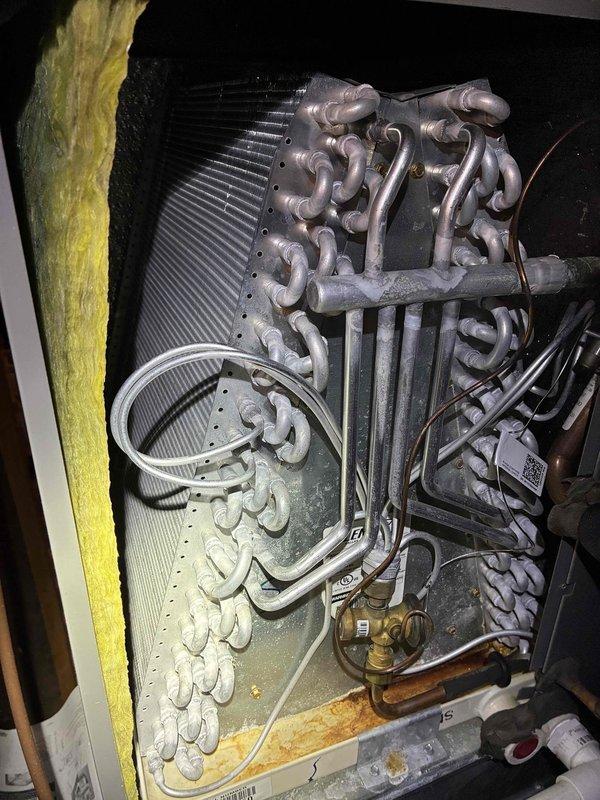 Performed comprehensive cooling system tune-up on 7-year-old air conditioning unit per promotional maintenance package. Conducted thorough inspection of evaporator coil assembly, verified proper refrigerant line connections, and examined electrical components including capacitor and contactor within control panel. All systems found operating within normal parameters with no immediate service needs identified.