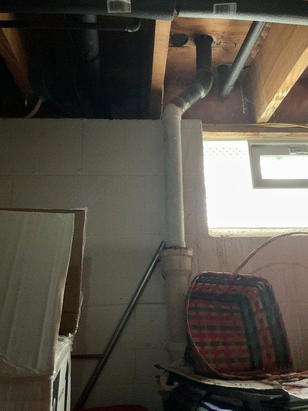 Responded to emergency call for hole in pipe under kitchen sink causing water to gush out during use, threatening newly installed flooring. Accessed plumbing assembly beneath sink and identified compromised section of pipe requiring immediate replacement to prevent further water damage. Replaced damaged pipe section with appropriate materials and secured all connections to restore proper water flow and eliminate leakage. Inspected separate hot water spigot under sink used for beverages and found loose housing requiring attention. Tightened mounting hardware and assessed spigot assembly for structural integrity. Tested all plumbing connections under pressure to verify leak-free operation and proper function of both main supply lines and beverage spigot. Cleaned work area and confirmed no water damage to surrounding cabinetry or newly installed flooring.