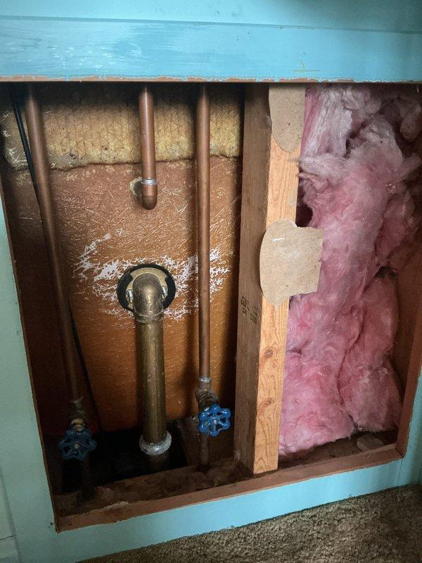 Responded to service call for stuck Moen push-pull bathtub/shower diverter valve that had not been operated in several years. Accessed plumbing system through wall opening to evaluate valve mechanism and supply lines. Inspected shut-off valves and copper supply piping to determine best approach for freeing seized diverter stem without damaging cartridge or trim components. Successfully restored full operation of push-pull diverter and rotational temperature control handle, allowing proper switching between tub spout and showerhead functions.