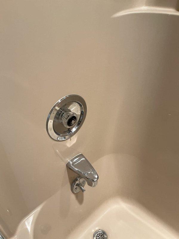 Responded to service call for stuck Moen push-pull bathtub/shower diverter valve that had not been operated in several years. Accessed plumbing system through wall opening to evaluate valve mechanism and supply lines. Inspected shut-off valves and copper supply piping to determine best approach for freeing seized diverter stem without damaging cartridge or trim components. Successfully restored full operation of push-pull diverter and rotational temperature control handle, allowing proper switching between tub spout and showerhead functions.