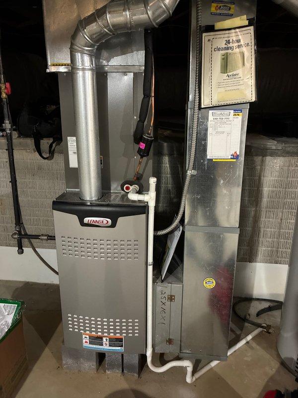 Completed scheduled maintenance inspection on 4-year-old Lennox furnace system as part of recurring MVP service agreement. Removed access panel and performed comprehensive visual inspection of all internal components including blower motor assembly, heat exchanger, burner assembly, and control board. Verified all electrical connections were secure with proper wire routing throughout the unit. Inspected control board for signs of wear or damage, confirmed all wire harnesses properly seated in terminals. Examined blower motor housing and mounting brackets for stability and proper operation. Assessed heat exchanger surface condition and verified integrity with no visible cracks or deterioration. Checked all safety labels and documentation remained legible and properly affixed. Verified ductwork connections at furnace plenum were secure with no air leakage. System operational and functioning within normal parameters upon completion of inspection.