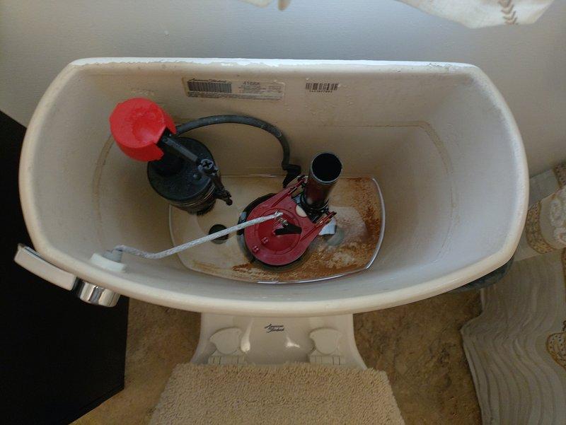 Responded to service call for two toilets experiencing continuous running. Inspected first toilet tank and identified worn flush valve flapper assembly causing improper seal, allowing water to leak from tank into bowl. Float valve assembly also showed signs of age with mineral buildup present throughout tank interior. Replaced defective flapper and chain assembly to restore proper seal. Adjusted float valve settings to ensure proper water level and shutoff. Inspected second fixture and addressed similar running condition by replacing faulty flush valve components. Tested both toilets through multiple flush cycles to verify proper operation and confirm complete shutoff after each flush. Both units now functioning correctly with no continuous water flow.