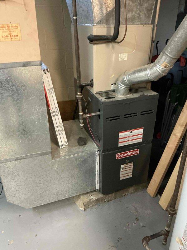 Conducted on-site evaluation for replacement of existing 20-year-old furnace and air conditioning system. Assessed current HVAC equipment condition, measured installation space, and documented existing ductwork configuration in basement utility area. Provided comprehensive replacement estimate for new heating and cooling system to address aging equipment concerns.