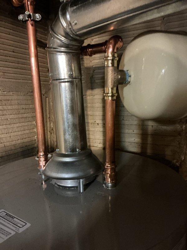 Installed new 40-gallon tall water heater with 10-year warranty, including complete plumbing connections with copper piping, pressure relief valve, and wall-mounted expansion tank. Installed new icemaker supply line to provide dedicated water connection for refrigerator ice maker. All components professionally staged, assembled, and tested to ensure proper operation and code compliance.