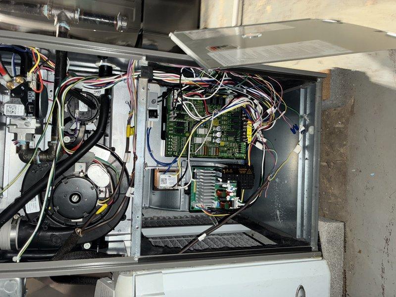 Performed comprehensive AC maintenance on 2-year-old cooling system. Inspected blower wheel assembly and confirmed proper operation with normal dust accumulation for unit age. Examined all internal electrical components including control boards, wiring harnesses, contactors, and blower motor, verifying secure connections and proper function. Unit tested and operating within normal parameters.