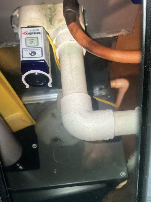 Completed comprehensive maintenance visit protocol on an 8-year-old residential air conditioning system. Performed thorough inspection of all major components including condensate drainage system, electrical control board, wiring connections, and refrigerant lines. Verified proper operation of all safety controls, relays, and monitoring devices. Inspected PVC condensate drain configuration for proper pitch and drainage, checked for moisture accumulation in air handler cabinet, and examined copper refrigerant line insulation. Evaluated control board connections and verified secure terminations of all color-coded wiring at terminal blocks. System operating within normal parameters upon completion of maintenance procedures.