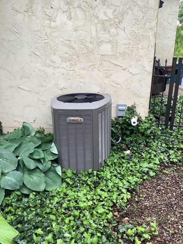 Completed scheduled BS-MVP cooling maintenance visit on residential Lennox HVAC system. Performed comprehensive inspection of indoor furnace unit located in basement utility area and outdoor condenser unit. Verified proper operation of all system components, checked refrigerant levels, inspected electrical connections at both indoor and outdoor units, and confirmed drainage system functionality. All equipment operating within normal parameters with green indicator light showing system status. Unit maintained proper airflow through condenser coils, and PVC venting and drainage piping secure and functioning correctly.