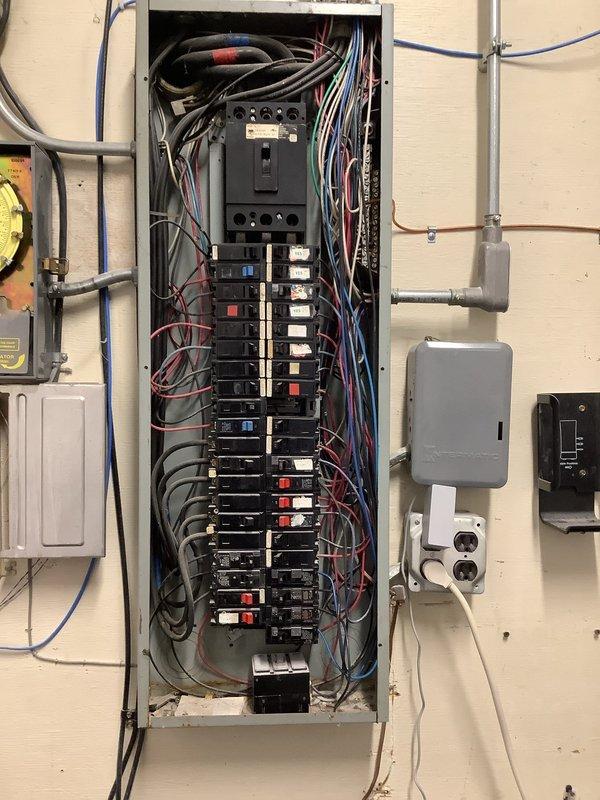 Provided complimentary second opinion for commercial lighting control issue where employees were required to access the breaker panel to operate lights. Evaluated existing electrical panel configuration and breaker mapping system, documented current lighting circuits serving office spaces and computer areas. Recommended installation of additional wall-mounted light switch to provide convenient local control and eliminate need for staff to access electrical panel for routine lighting operations.