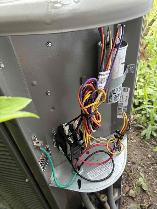 Completed comprehensive MVP AC maintenance on residential outdoor cooling unit. Performed thorough inspection of condenser unit exterior, verified proper clearance around equipment and adequate airflow through louvered panels. Accessed electrical compartment and inspected all internal components including contactor, capacitor, and associated wiring connections. Verified all electrical connections were secure and free of corrosion, confirmed capacitor readings within manufacturer specifications, and ensured proper operation of contactor. System operating efficiently with no deficiencies noted.