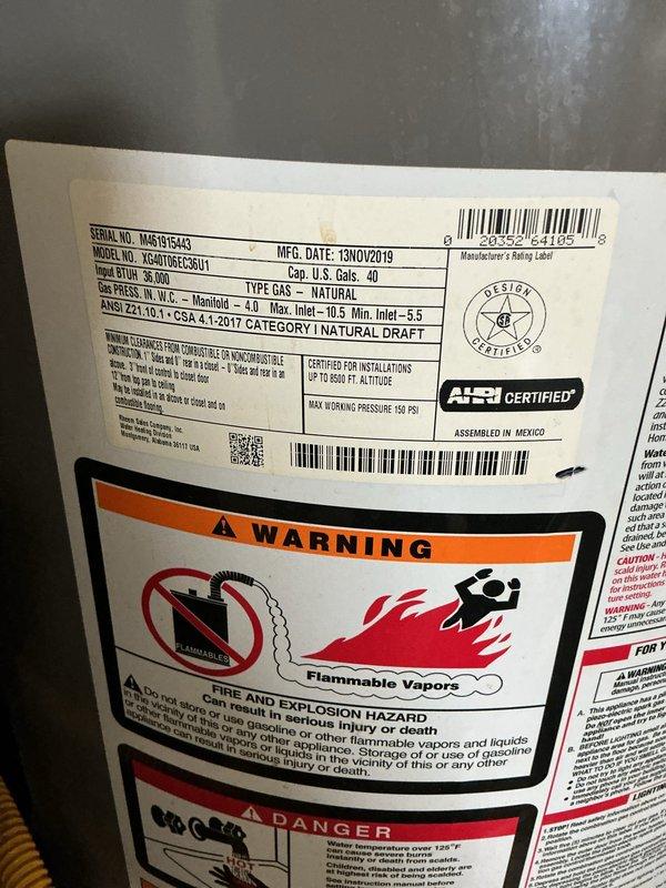 Responded to water leak at top of residential water heater. Upon inspection, identified a 40-gallon Rheem Performance natural gas water heater (Model YE40T06ET-58U1) manufactured in November 2019. Examined top connections including temperature/pressure relief valve, cold water inlet with braided stainless steel connector, and hot water outlet assembly. Documented existing plumbing configuration with copper supply lines and galvanized piping. Assessed leak source at upper tank connections and provided recommendations for repair or replacement based on findings.