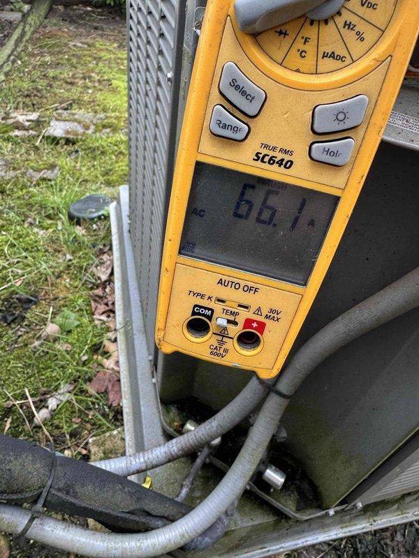 Performed comprehensive tune-up on 6-year-old air conditioning system. Inspected dual-run capacitor (40+5 MFD, 440VAC) and noted corrosion on terminal housing but confirmed proper electrical connections and functionality. Measured system amperage at 6.67A, verifying compressor operation within normal parameters. All electrical connections secured, system tested and operating efficiently.