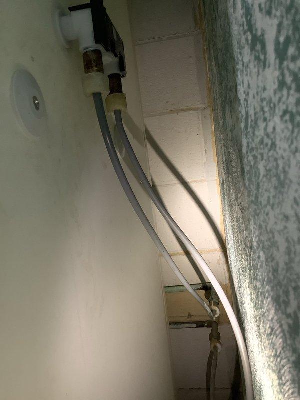Installed shutoff valves in a 1955-built residence to provide proper water isolation capability. The installation addressed the absence of functional shutoff valves in the existing plumbing system, which included both interior and exterior piping configurations with PVC and copper components.